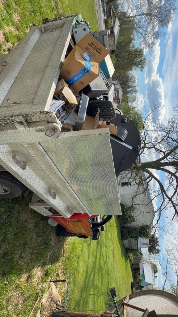 ClearPath crew loading debris onto a dump trailer